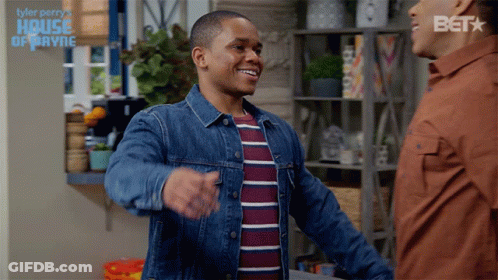 A Man In A Denim Jacket Is Hugging Another Man In A House Of Payne Advertisement GIF