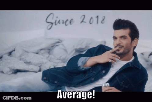 Man In Denim Jacket Sitting Smoking Whiskey GIF
