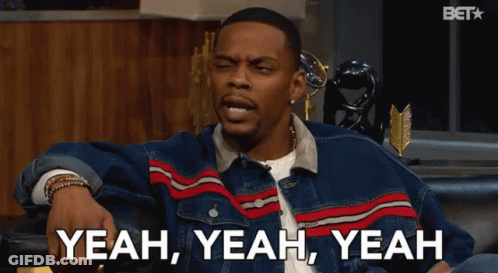 A Man In A Denim Jacket Is Sitting On A Couch And Says Yeah Yeah Yeah GIF
