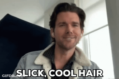 A Man In A Denim Jacket Is Smiling And Says Slick Cool Hair . GIF