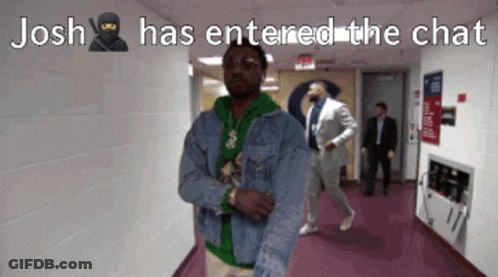 A Man In A Denim Jacket Is Standing In A Hallway With The Caption " Josh Has Entered The Chat " GIF