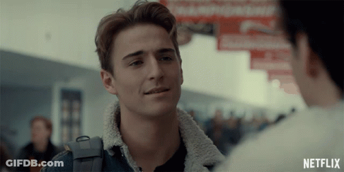 A Man In A Denim Jacket Is Talking To Another Man With A Netflix Logo In The Corner GIF