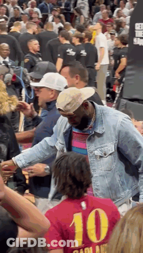 A Man In A Denim Jacket With The Number 10 On The Back GIF