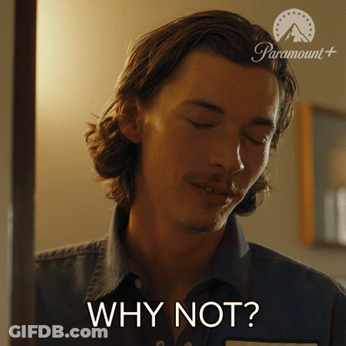 A Man In A Denim Shirt Is Asking Why Not GIF