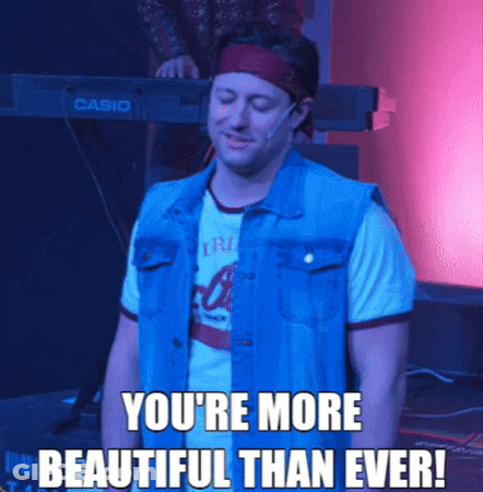 A Man In A Denim Vest Is Standing In Front Of A Casio Keyboard GIF