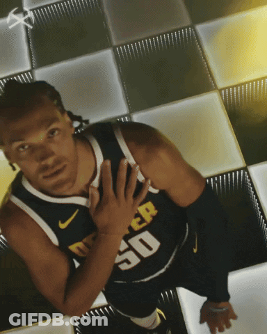 A Man In A Denver 50 Jersey Stands On A Checkerboard Floor GIF