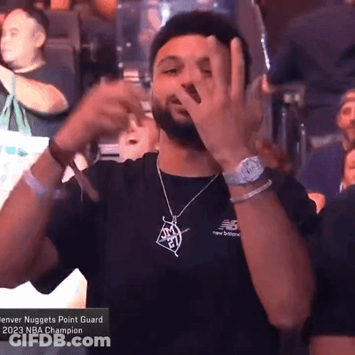 A Man In A Denver Nuggets Point Guard T-Shirt Making A Funny Face GIF