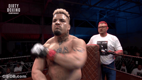 A Man In A Dirty Boxing Championship Shirt GIF