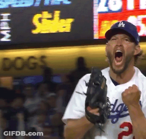 A Man In A Dodgers Uniform Is Holding A Baseball Glove GIF