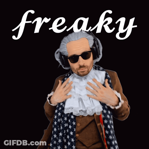 A Man In A Fancy Dress Costume With The Word Freaky Behind Him GIF