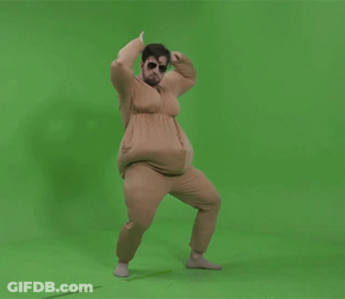 A Man In A Fat Suit Is Dancing On A Green Background GIF