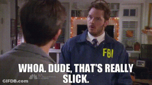 A Man In A Fbi Uniform Talking To Another Man . GIF