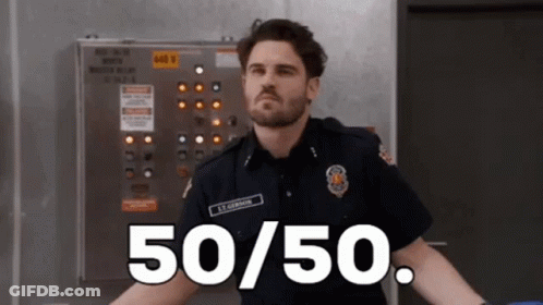 A Man In A Fireman 'S Uniform Is Standing In Front Of A Control Panel That Says 50/50 GIF