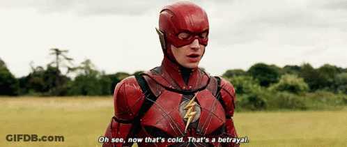 A Man In A Flash Costume Is Standing In A Field And Saying " Oh See , Now That 'S Cold . GIF