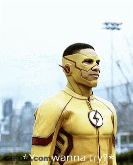 A Man In A Flash Costume Is Standing In Front Of A City Skyline And Says " You Wanna Try " GIF