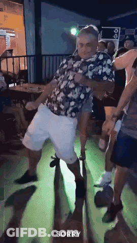 Man Dancing In Floral Shirt And Shorts GIF