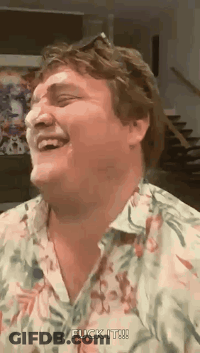A Man In A Floral Shirt Is Laughing And Saying " Fuck It " . GIF