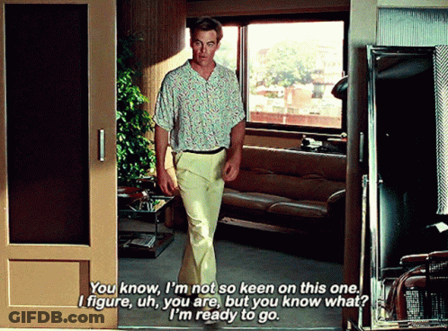 A Man In A Floral Shirt Is Talking To Another Man GIF
