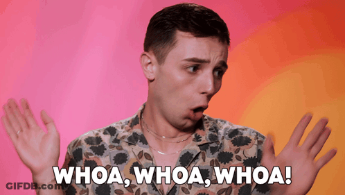 A Man In A Floral Shirt Says Whoa Whoa Whoa With His Hands Outstretched GIF