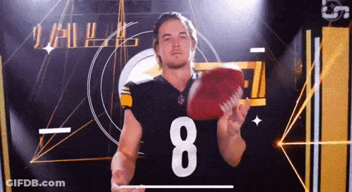 A Man In A Football Jersey With The Number 8 On It GIF