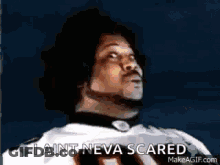 A Man In A Football Uniform Is Looking Up And Saying I Ain T Neva Scared . GIF