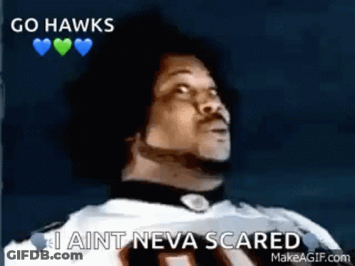 A Man In A Football Uniform Is Saying `` Go Hawks , I Ain T Neva Scared '' . GIF
