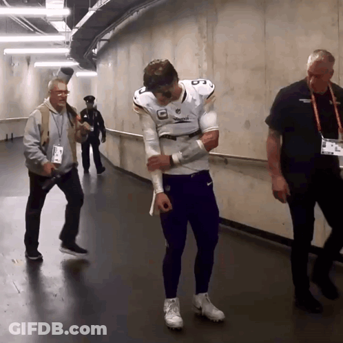 A Man In A Football Uniform With The Number 8 On His Chest GIF