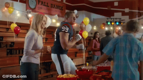 A Man In A Football Uniform With The Number 99 On His Jersey GIF