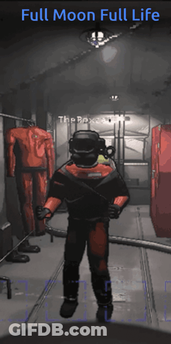 A Man In A Full Moon Full Life Suit Is Standing In A Room GIF