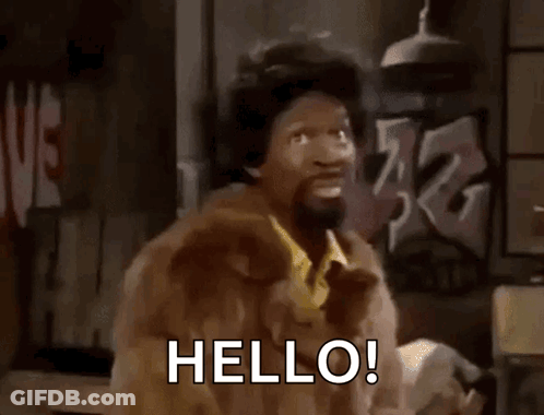 A Man In A Fur Coat Is Saying Hello GIF