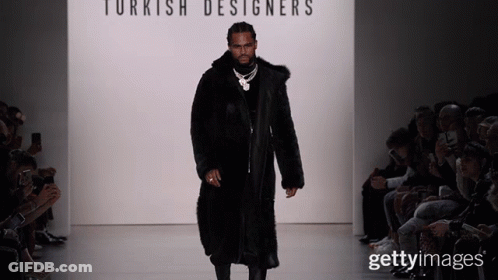 A Man In A Fur Coat Walks Down A Runway At A Turkish Designer 'S Fashion Show GIF