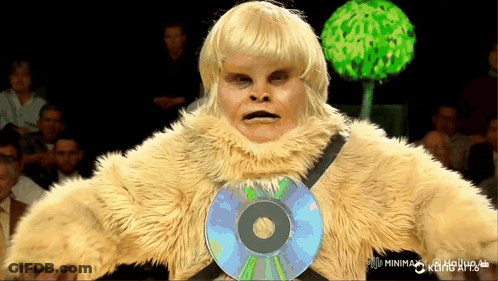 A Man In A Furry Costume Has A Cd On His Chest GIF