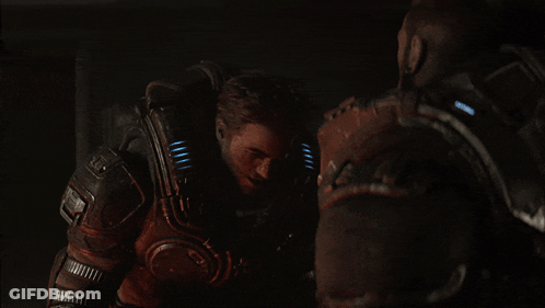 A Man In A Futuristic Armor With A Light On His Chest GIF