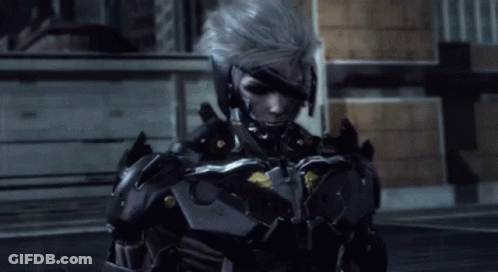 A Man In A Futuristic Armored Suit Is Standing In Front Of A Building GIF