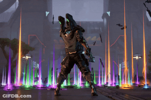 A Man In A Futuristic Suit Is Standing In Front Of A Colorful Fountain GIF