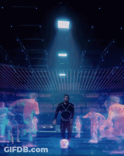 A Man In A Futuristic Suit Is Surrounded By Glowing Robots GIF