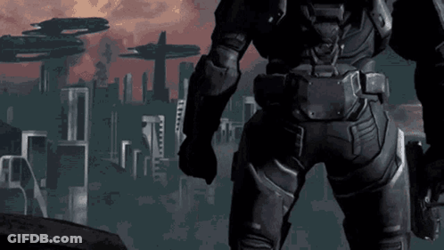 A Man In A Futuristic Suit Stands In Front Of A City GIF