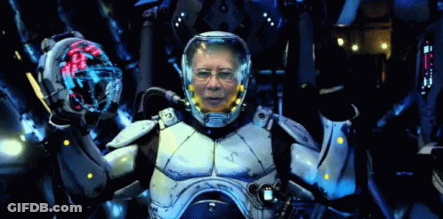 A Man In A Futuristic Suit With A Helmet That Says ' Vc ' On It GIF