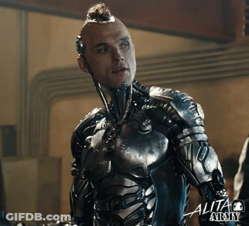 A Man In A Futuristic Suit With The Word Alita At The Bottom Right GIF