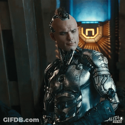 A Man In A Futuristic Suit With The Word Alita On The Bottom GIF