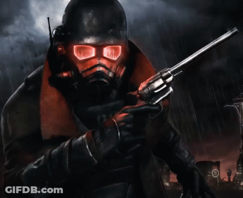 A Man In A Gas Mask Holding A Gun GIF