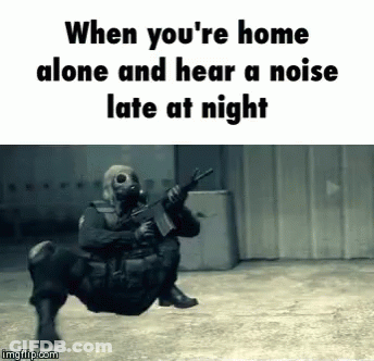 A Man In A Gas Mask Is Holding A Gun And The Caption Says When You 'Re Home Alone GIF
