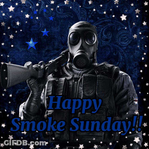 A Man In A Gas Mask Is Holding A Gun And The Words Happy Smoke Sunday GIF