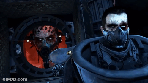 A Man In A Gas Mask Is Looking Through A Hole In A Wall GIF