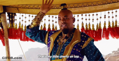 A Man In A Genie Costume Is Saying That 'S My Little Cherry On Top . GIF