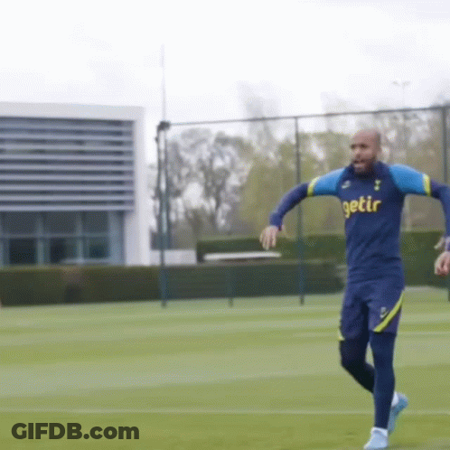 A Man In A Getir Shirt Is Running On A Soccer Field GIF