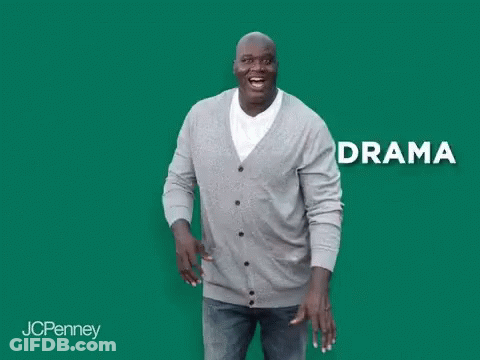 A Man In A Gray Cardigan And Jeans Is Laughing With The Word Anxiety Behind Him . GIF