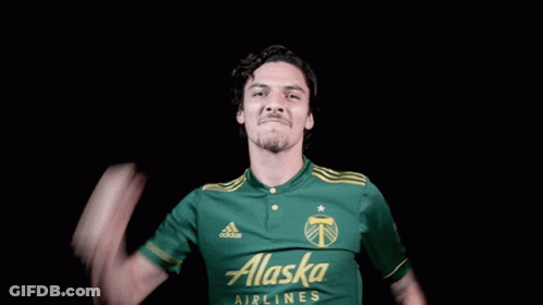 A Man In A Green Alaska Airlines Jersey GIF