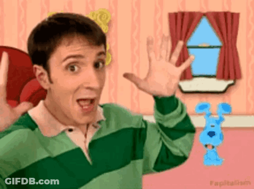 A Man In A Green And White Striped Shirt Is Standing In Front Of A Window With A Blue Dog In The Background . GIF