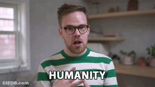 A Man In A Green And White Striped Shirt With The Word Humanity On It GIF